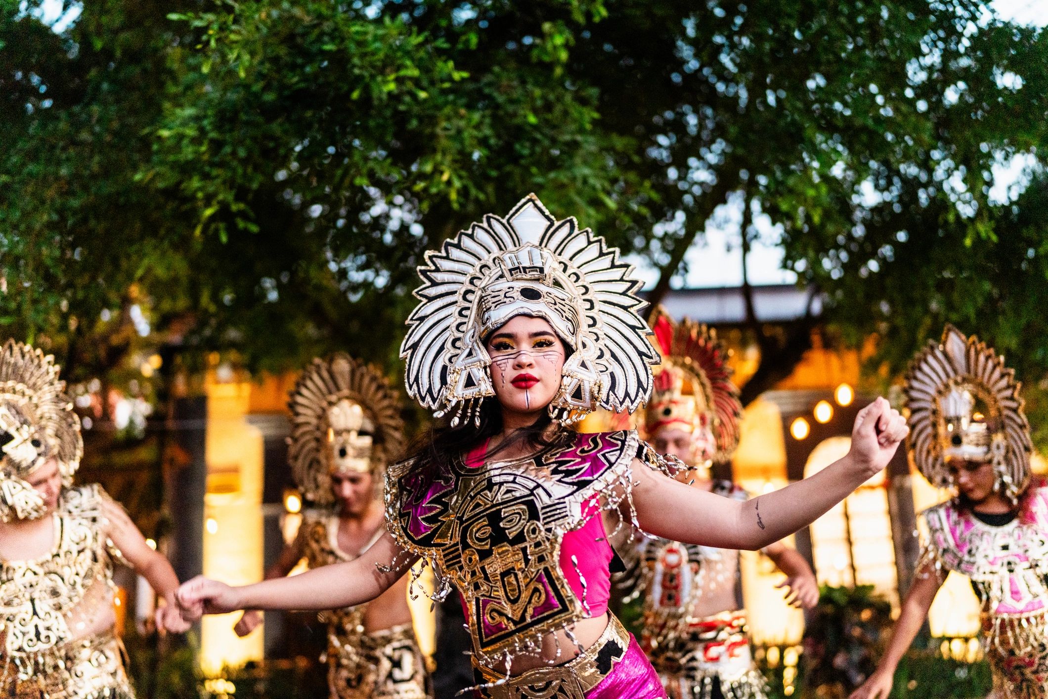 Friends enjoying a lively outdoor costume-inspired event