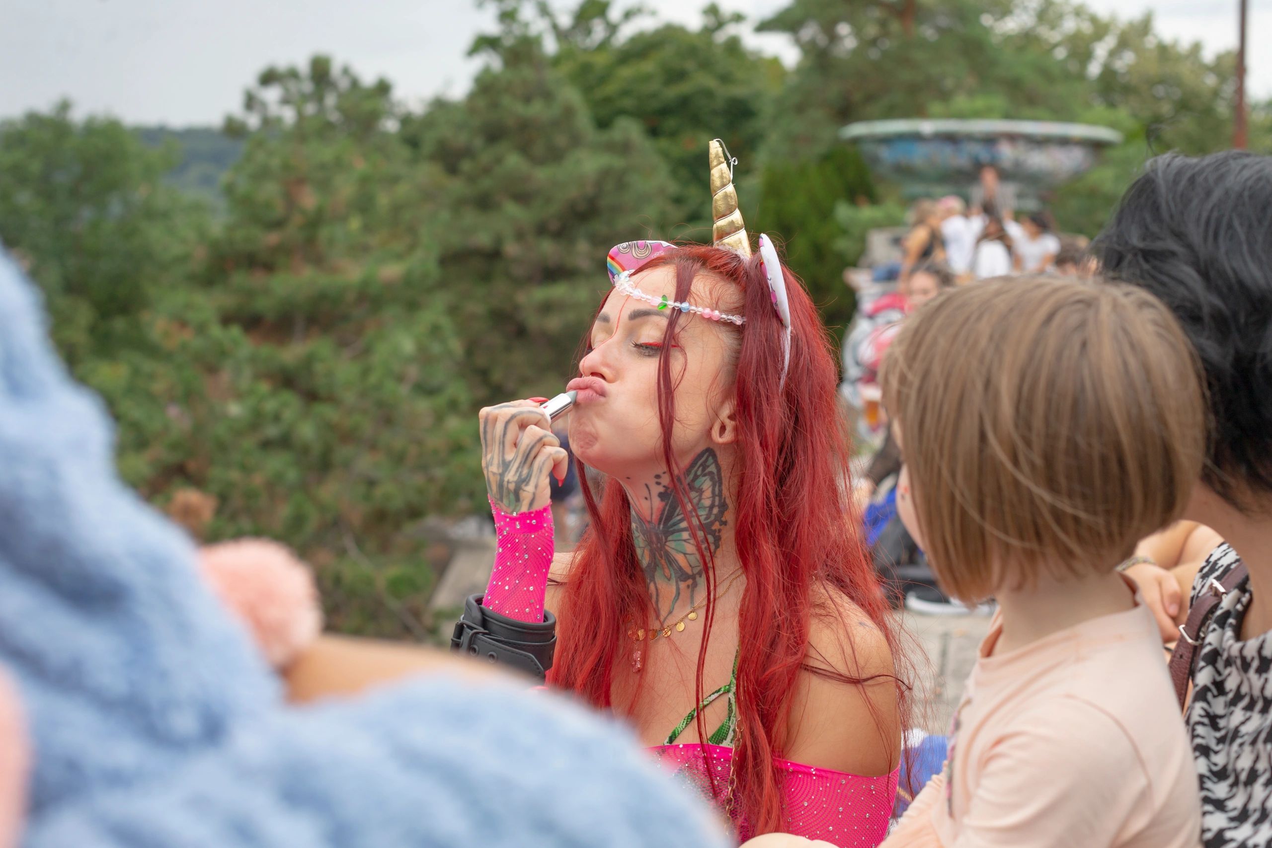 Colorful festival performer entertaining a lively outdoor crowd